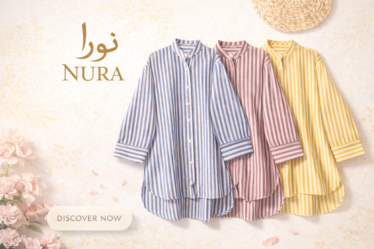 Softly structured blouse from Nura Collection with gentle silhouette and refined details for modern workwear comfort.